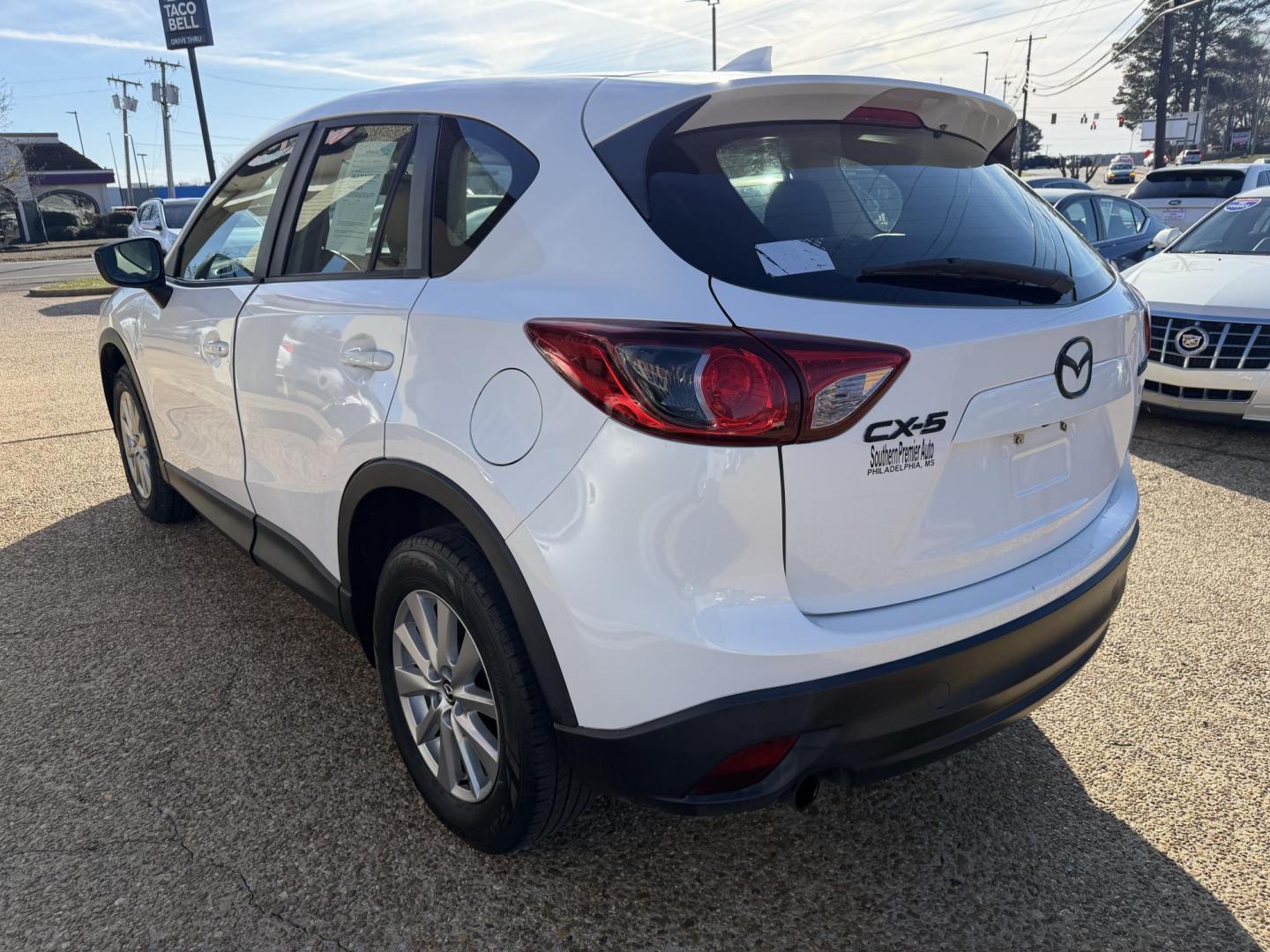2016 WHITE /Grey MAZDA CX-5 SPORT Sport (JM3KE2BY6G0) with an 2.5L L4 DOHC 16V engine, 6-Speed Automatic transmission, located at 922 W. Beacon St., Philadelphia, MS, 39350, (601) 650-3675, 32.770447, -89.127151 - Title: 2016 Mazda CX-5 Sport AT Year: 2016 Make: Mazda Model: CX-5 Engine: 2.5L L4 DOHC 16V Body: SPORT UTILITY 4-DR Transmission: 6-Speed Automatic Drive Type: FWD Mpg City: 26 Mpg: 33 Trim: Sport AT - Photo#3