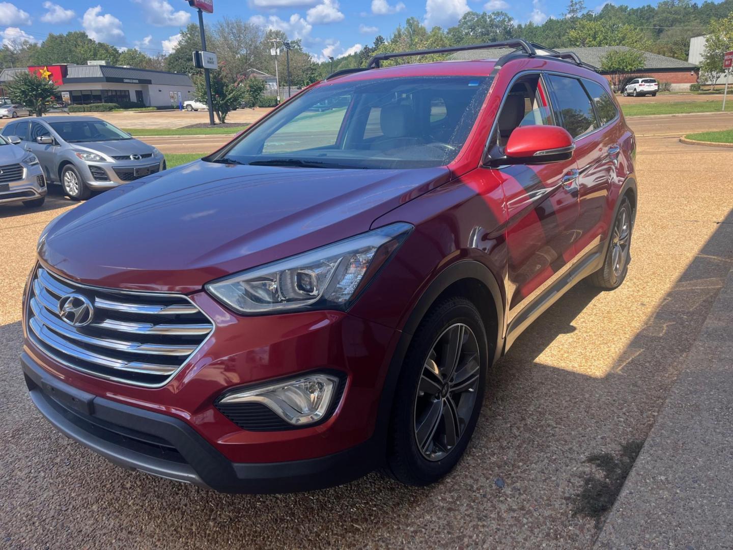 2014 RED HYUNDAI SANTA FE GLS Limited (KM8SN4HF5EU) with an 3.3L V6 DOHC 24V engine, 6-Speed Automatic transmission, located at 922 W. Beacon St., Philadelphia, MS, 39350, (601) 650-3675, 32.770447, -89.127151 - Title: 2014 Hyundai Santa Fe GLS FWD Year: 2014 Make: Hyundai Model: Santa Fe Engine: 3.3L V6 DOHC 24V Body: SPORT UTILITY 4-DR Transmission: 6-Speed Automatic Drive Type: FWD Mpg City: 18 Mpg: 25 Trim: GLS FWD - Photo#1
