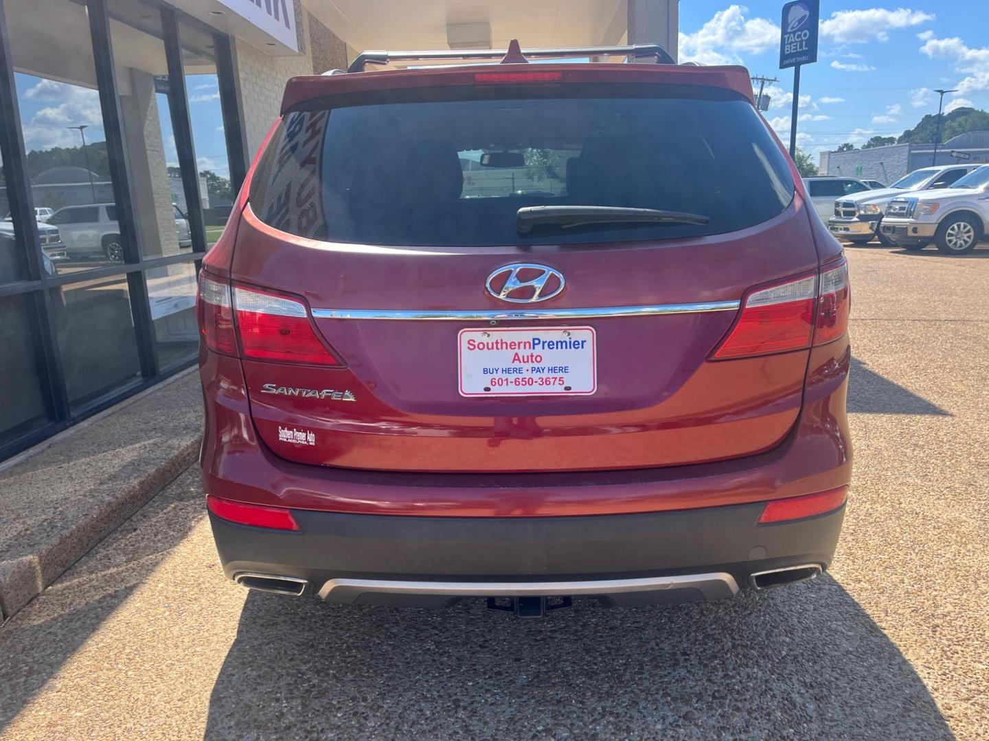 2014 RED HYUNDAI SANTA FE GLS Limited (KM8SN4HF5EU) with an 3.3L V6 DOHC 24V engine, 6-Speed Automatic transmission, located at 922 W. Beacon St., Philadelphia, MS, 39350, (601) 650-3675, 32.770447, -89.127151 - Title: 2014 Hyundai Santa Fe GLS FWD Year: 2014 Make: Hyundai Model: Santa Fe Engine: 3.3L V6 DOHC 24V Body: SPORT UTILITY 4-DR Transmission: 6-Speed Automatic Drive Type: FWD Mpg City: 18 Mpg: 25 Trim: GLS FWD - Photo#3