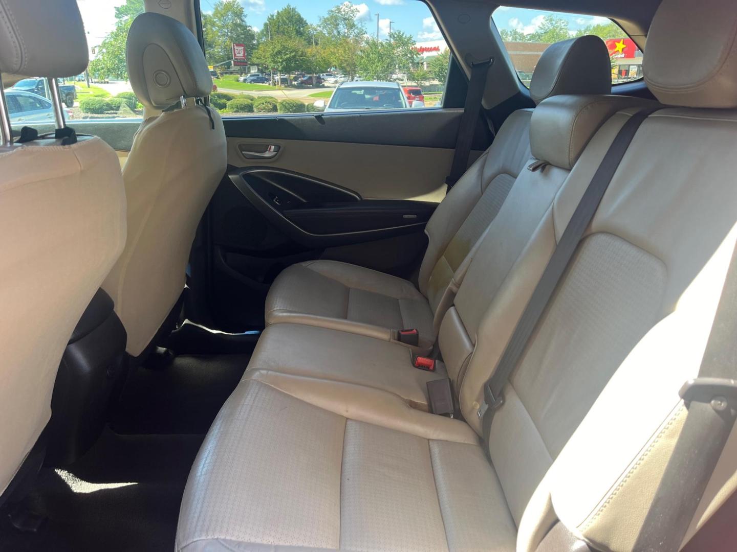 2014 RED HYUNDAI SANTA FE GLS Limited (KM8SN4HF5EU) with an 3.3L V6 DOHC 24V engine, 6-Speed Automatic transmission, located at 922 W. Beacon St., Philadelphia, MS, 39350, (601) 650-3675, 32.770447, -89.127151 - Title: 2014 Hyundai Santa Fe GLS FWD Year: 2014 Make: Hyundai Model: Santa Fe Engine: 3.3L V6 DOHC 24V Body: SPORT UTILITY 4-DR Transmission: 6-Speed Automatic Drive Type: FWD Mpg City: 18 Mpg: 25 Trim: GLS FWD - Photo#8