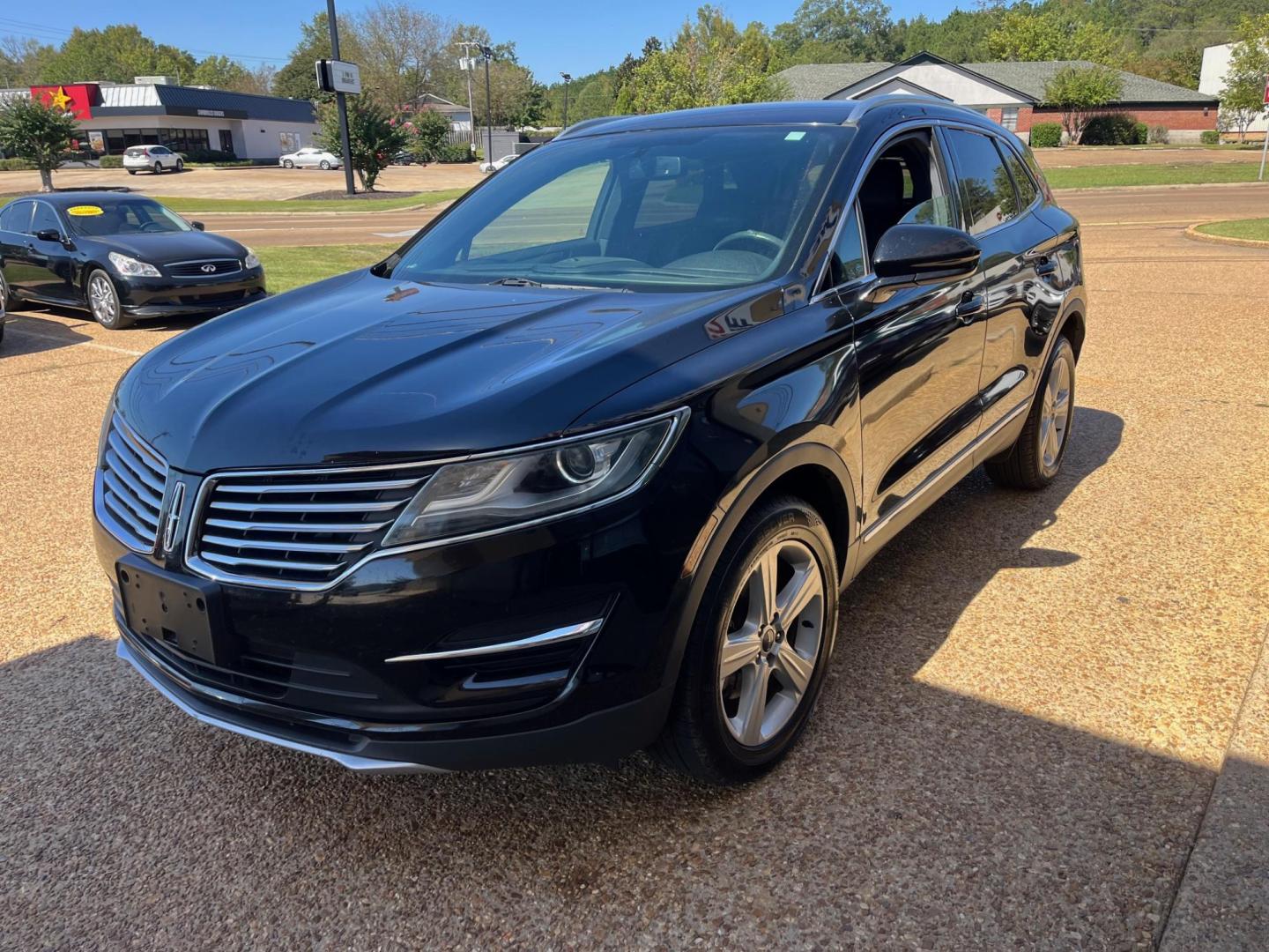 2017 BLACK /Black leather LINCOLN MKC PREMIER Limited (5LMCJ1C95HU) with an 2.0L L4 DOHC 16V engine, 6-Speed Automatic transmission, located at 922 W. Beacon St., Philadelphia, MS, 39350, (601) 650-3675, 32.770447, -89.127151 - Title: 2017 Lincoln MKC Premiere Year: 2017 Make: Lincoln Model: MKC Engine: 2.0L L4 DOHC 16V Body: SPORT UTILITY 4-DR Transmission: 6A Drive Type: FWD Mpg City: 20 Mpg: 29 Trim: Premiere - Photo#2
