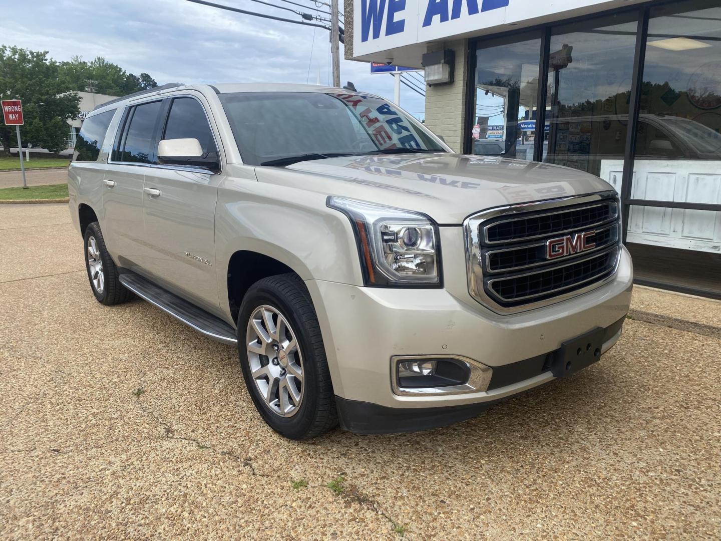 2015 TAN GMC YUKON XL SLT (1GKS1HKC8FR) , located at 922 W. Beacon St., Philadelphia, MS, 39350, (601) 650-3675, 32.770447, -89.127151 - Photo#0