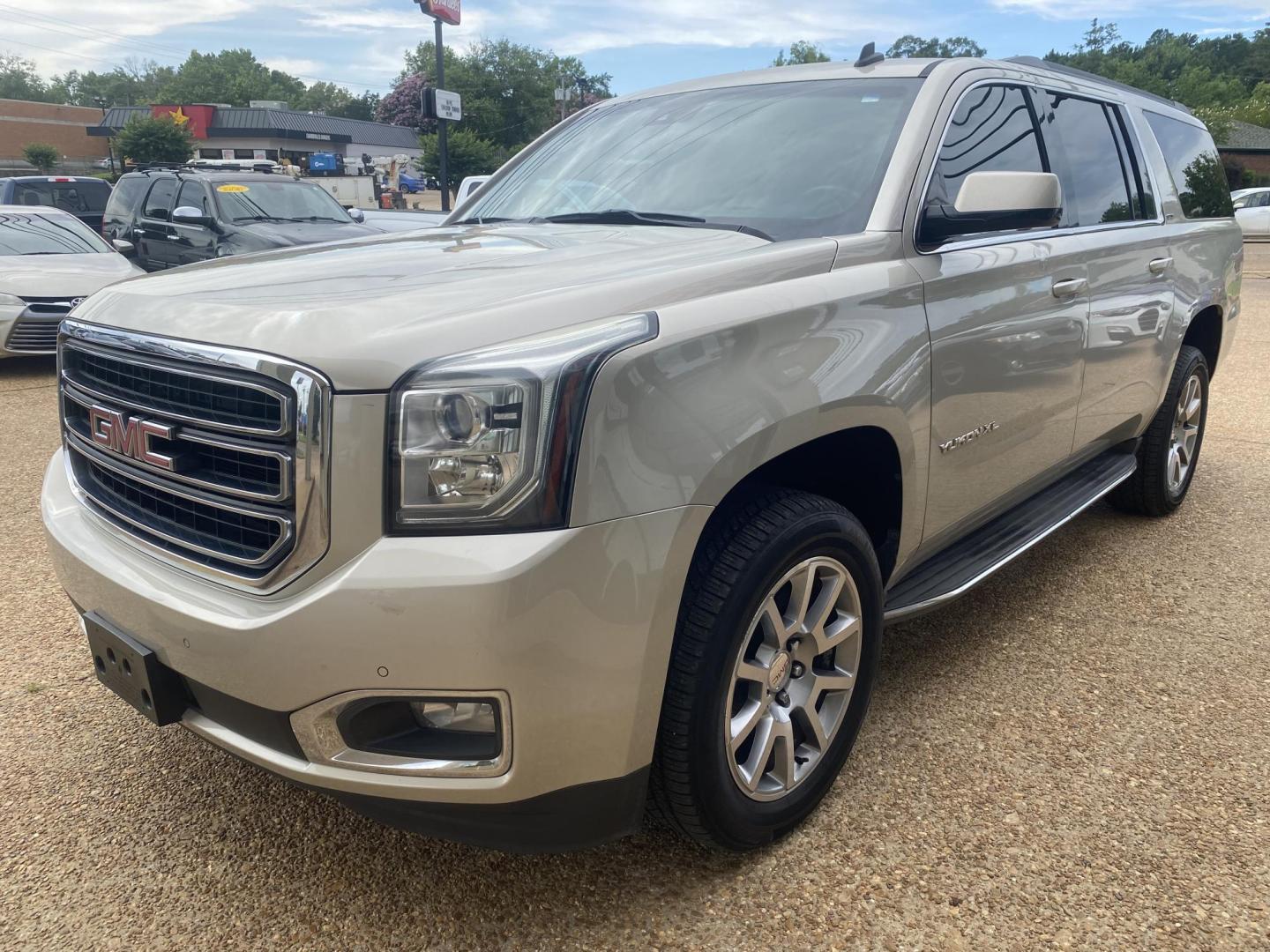 2015 TAN GMC YUKON XL SLT (1GKS1HKC8FR) , located at 922 W. Beacon St., Philadelphia, MS, 39350, (601) 650-3675, 32.770447, -89.127151 - Photo#2