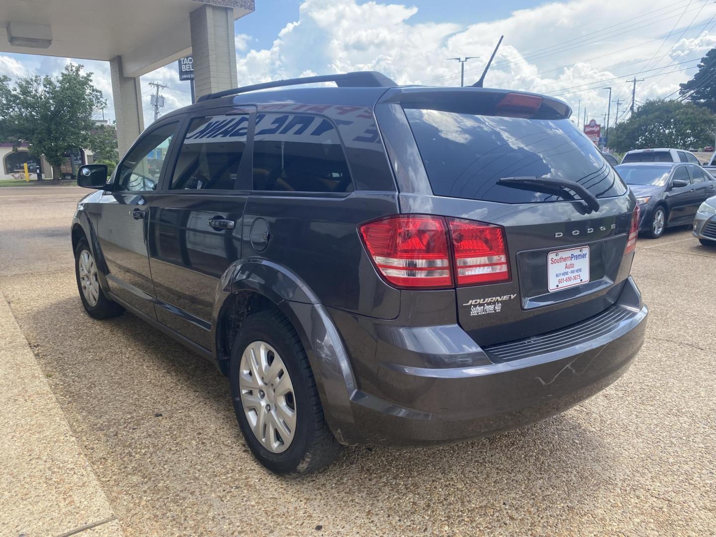 2017 BLACK DODGE JOURNEY SE (3C4PDCAB7HT) , located at 922 W. Beacon St., Philadelphia, MS, 39350, (601) 650-3675, 32.770447, -89.127151 - Photo#3