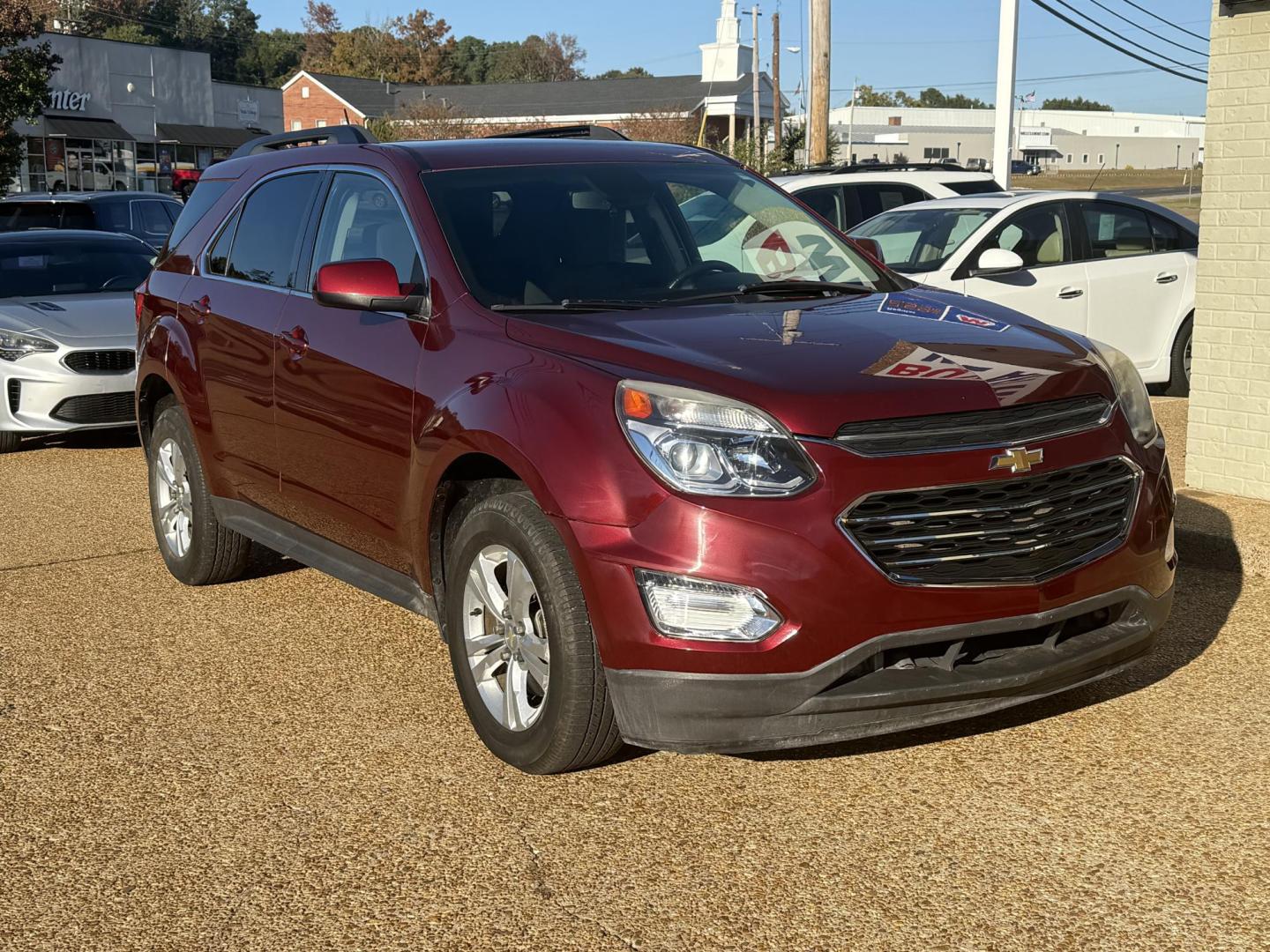 2017 RED CHEVROLET EQUINOX LT (2GNALCEK0H1) , located at 922 W. Beacon St., Philadelphia, MS, 39350, (601) 650-3675, 32.770447, -89.127151 - Photo#2