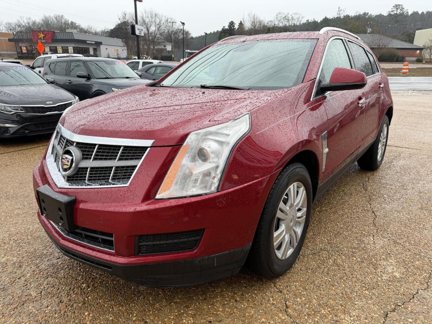 2012 RED CADILLAC SRX LUXURY (3GYFNAE34CS) , located at 922 W. Beacon St., Philadelphia, MS, 39350, (601) 650-3675, 32.770447, -89.127151 - Photo#2