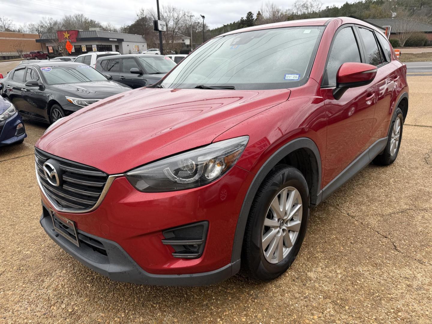 2016 RED MAZDA CX-5 TOURING (JM3KE2CY2G0) , located at 922 W. Beacon St., Philadelphia, MS, 39350, (601) 650-3675, 32.770447, -89.127151 - Photo#2