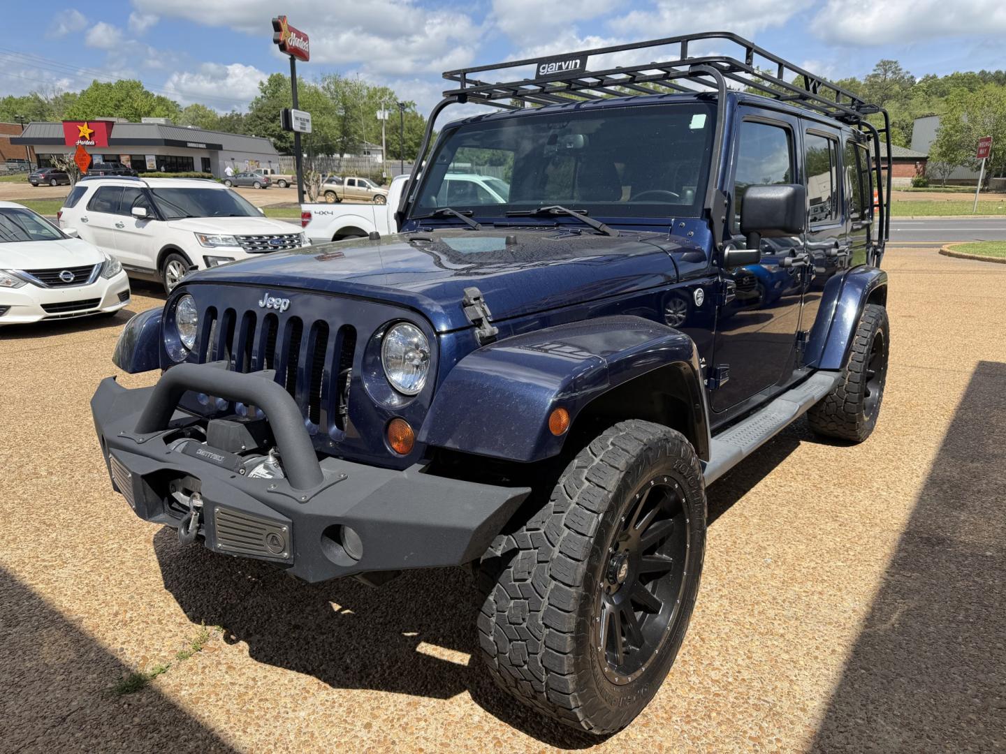2013 BLUE JEEP WRANGLER UNLIMITED S (1C4HJWEG6DL) , located at 922 W. Beacon St., Philadelphia, MS, 39350, (601) 650-3675, 32.770447, -89.127151 - Photo#2