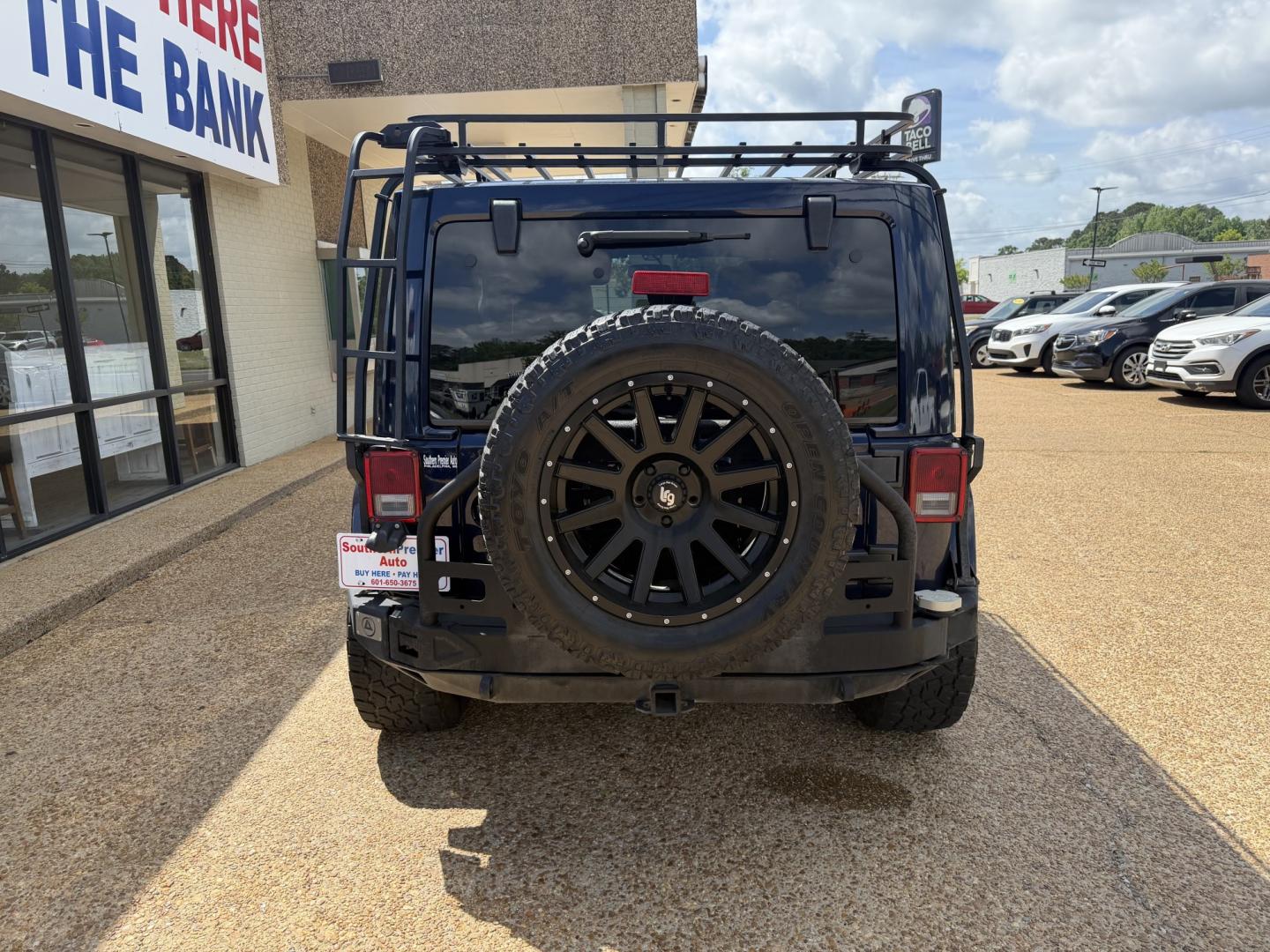 2013 BLUE JEEP WRANGLER UNLIMITED S (1C4HJWEG6DL) , located at 922 W. Beacon St., Philadelphia, MS, 39350, (601) 650-3675, 32.770447, -89.127151 - Photo#4
