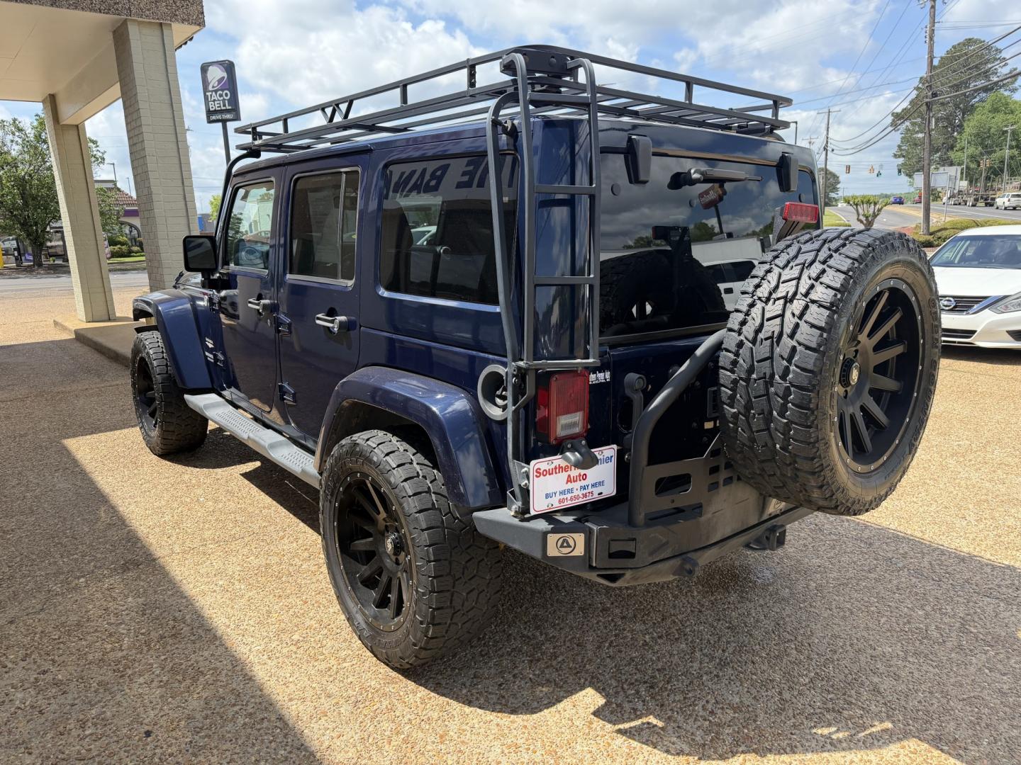 2013 BLUE JEEP WRANGLER UNLIMITED S (1C4HJWEG6DL) , located at 922 W. Beacon St., Philadelphia, MS, 39350, (601) 650-3675, 32.770447, -89.127151 - Photo#3