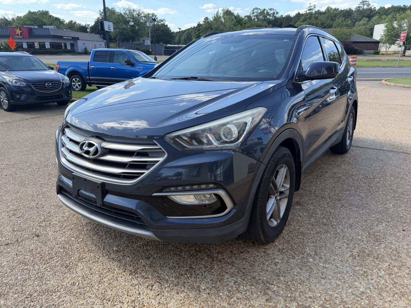 2017 BLUE HYUNDAI SANTA FE SPORT (5NMZU3LB4HH) , located at 922 W. Beacon St., Philadelphia, MS, 39350, (601) 650-3675, 32.770447, -89.127151- Photo#2