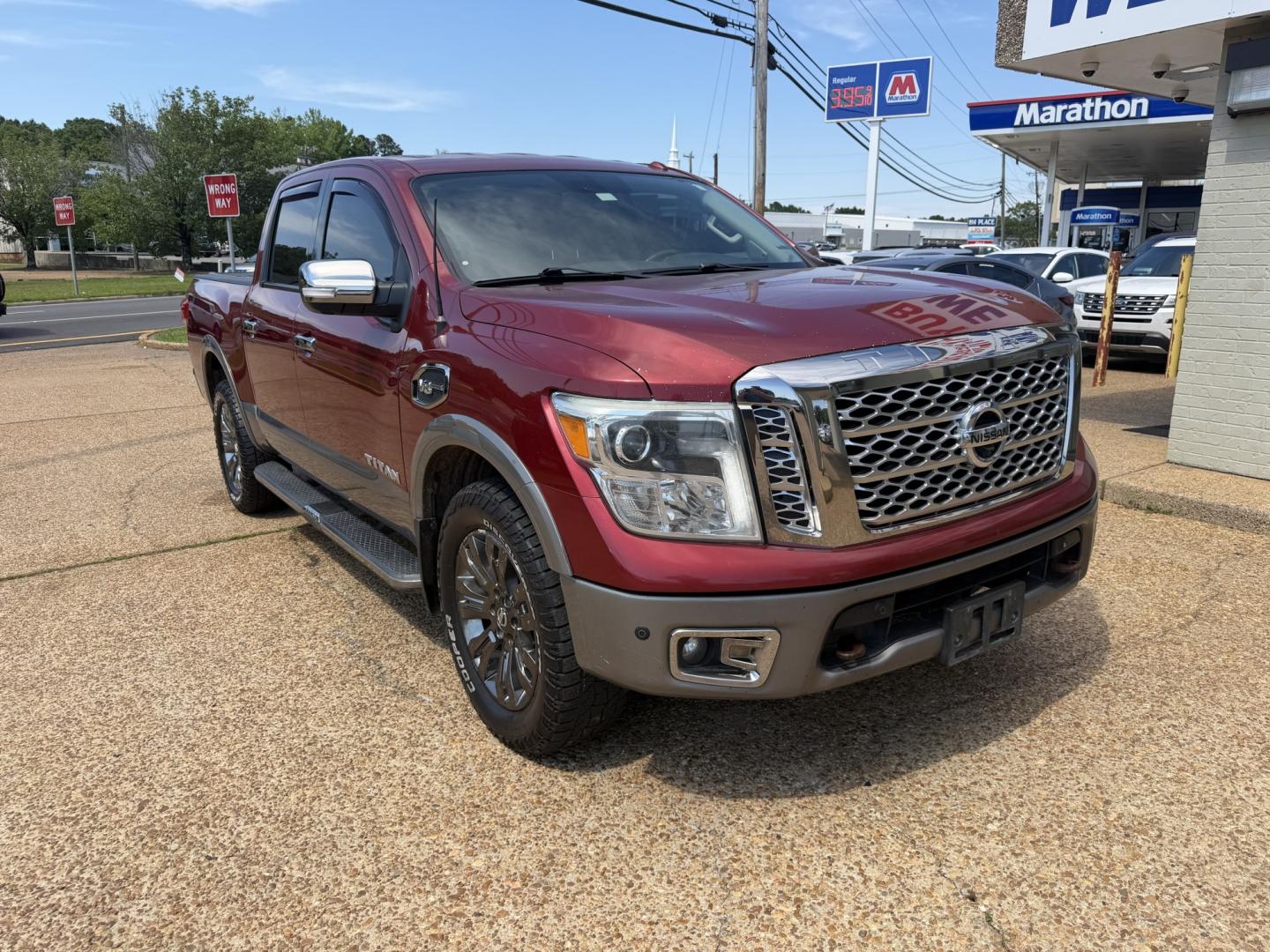 2017 RED NISSAN TITAN PLATINUM SV (1N6AA1E55HN) with an 5.6L 8CYL engine, located at 922 W. Beacon St., Philadelphia, MS, 39350, (601) 650-3675, 32.770447, -89.127151 - Photo#0