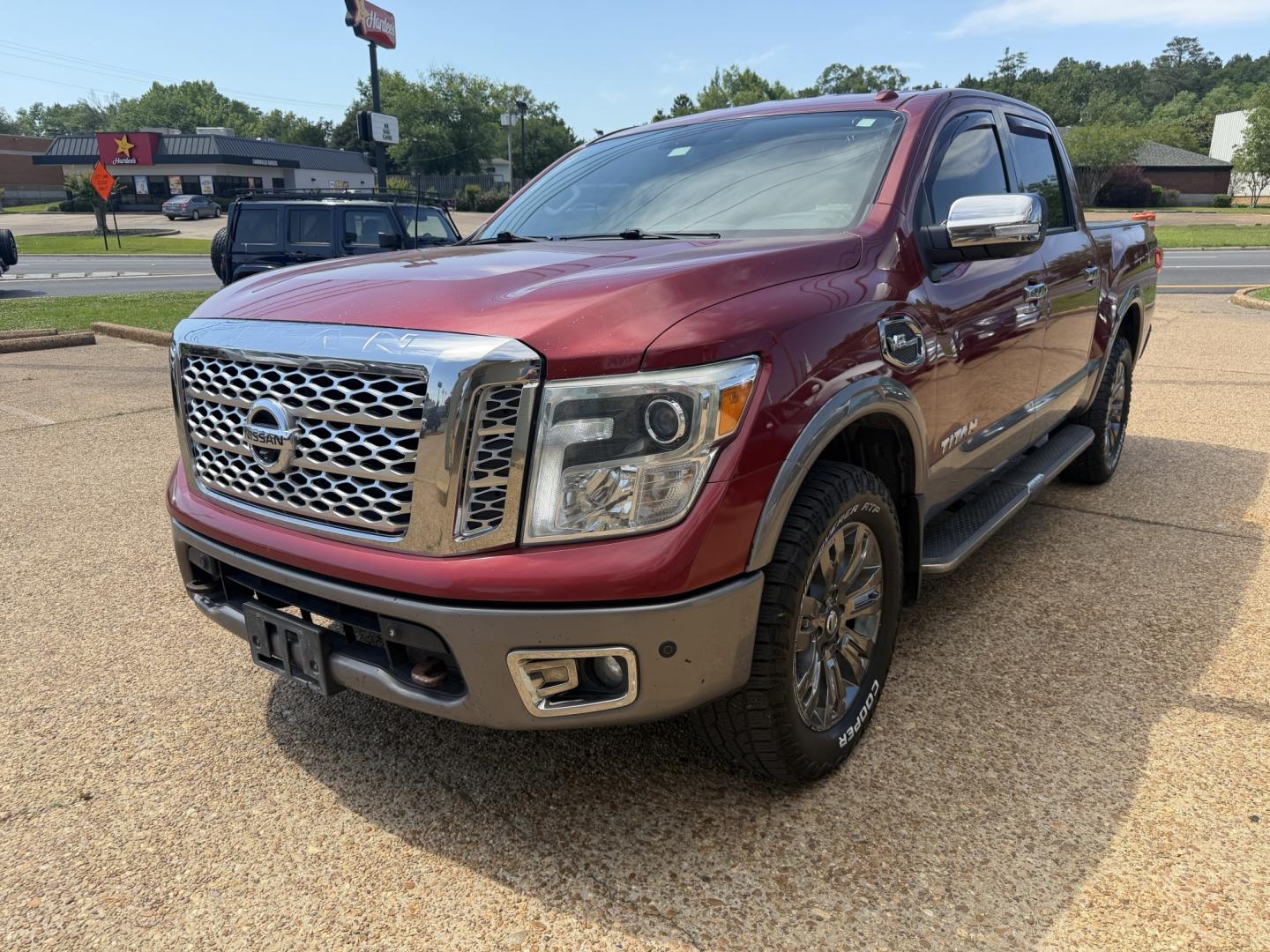 2017 RED NISSAN TITAN PLATINUM SV (1N6AA1E55HN) with an 5.6L 8CYL engine, located at 922 W. Beacon St., Philadelphia, MS, 39350, (601) 650-3675, 32.770447, -89.127151 - Photo#2