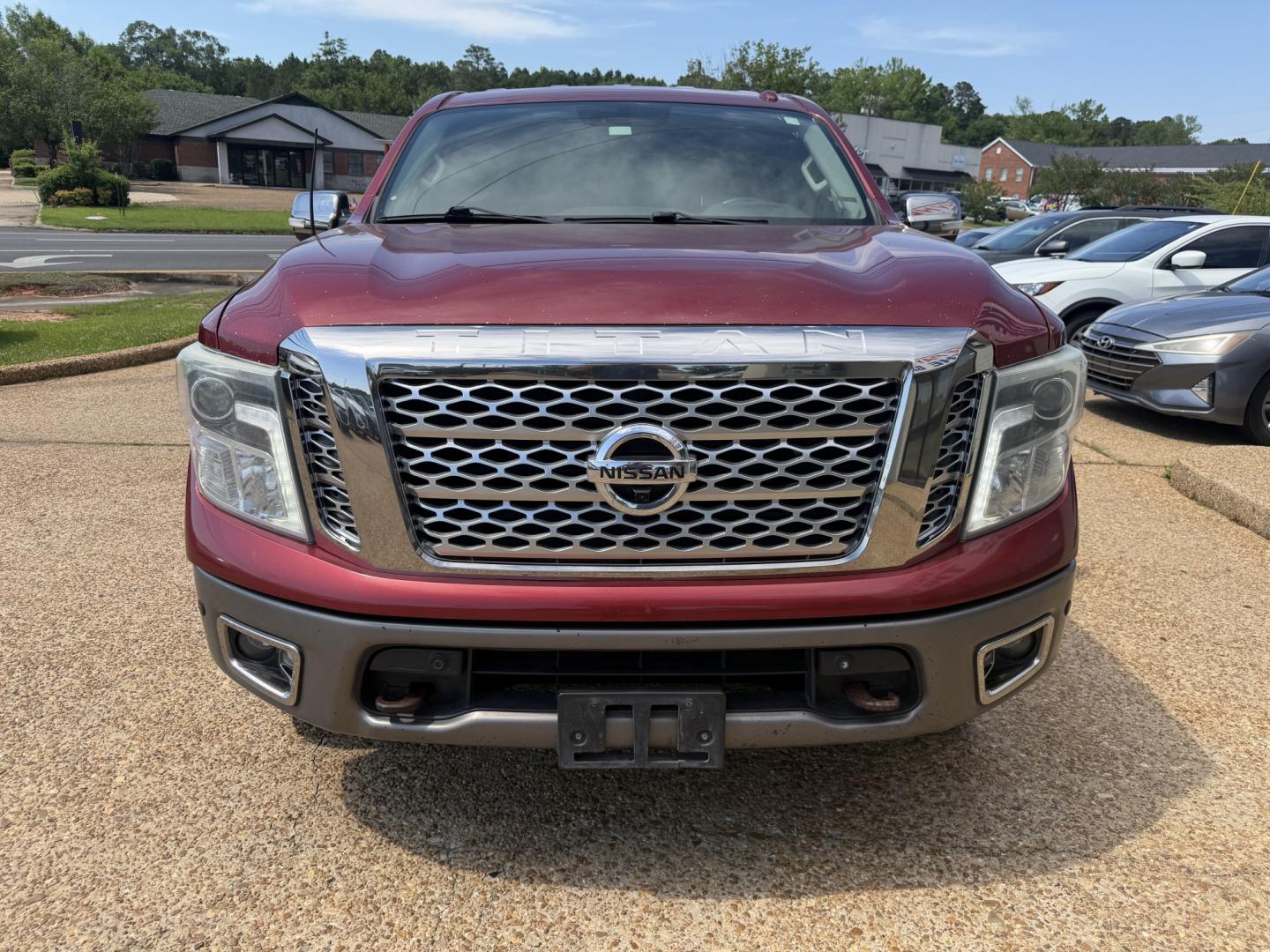 2017 RED NISSAN TITAN PLATINUM SV (1N6AA1E55HN) with an 5.6L 8CYL engine, located at 922 W. Beacon St., Philadelphia, MS, 39350, (601) 650-3675, 32.770447, -89.127151 - Photo#1