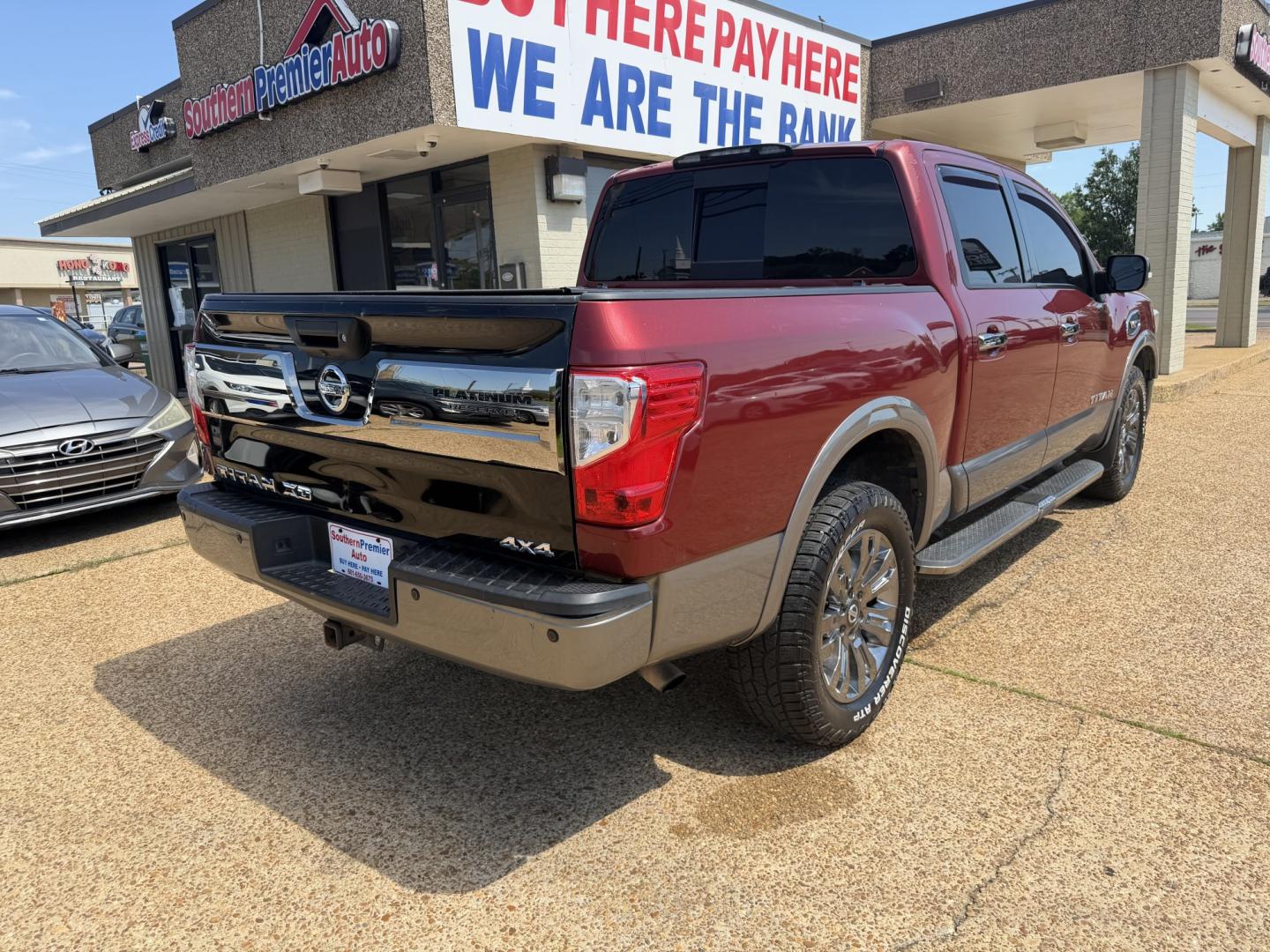 2017 RED NISSAN TITAN PLATINUM SV (1N6AA1E55HN) with an 5.6L 8CYL engine, located at 922 W. Beacon St., Philadelphia, MS, 39350, (601) 650-3675, 32.770447, -89.127151 - Photo#5