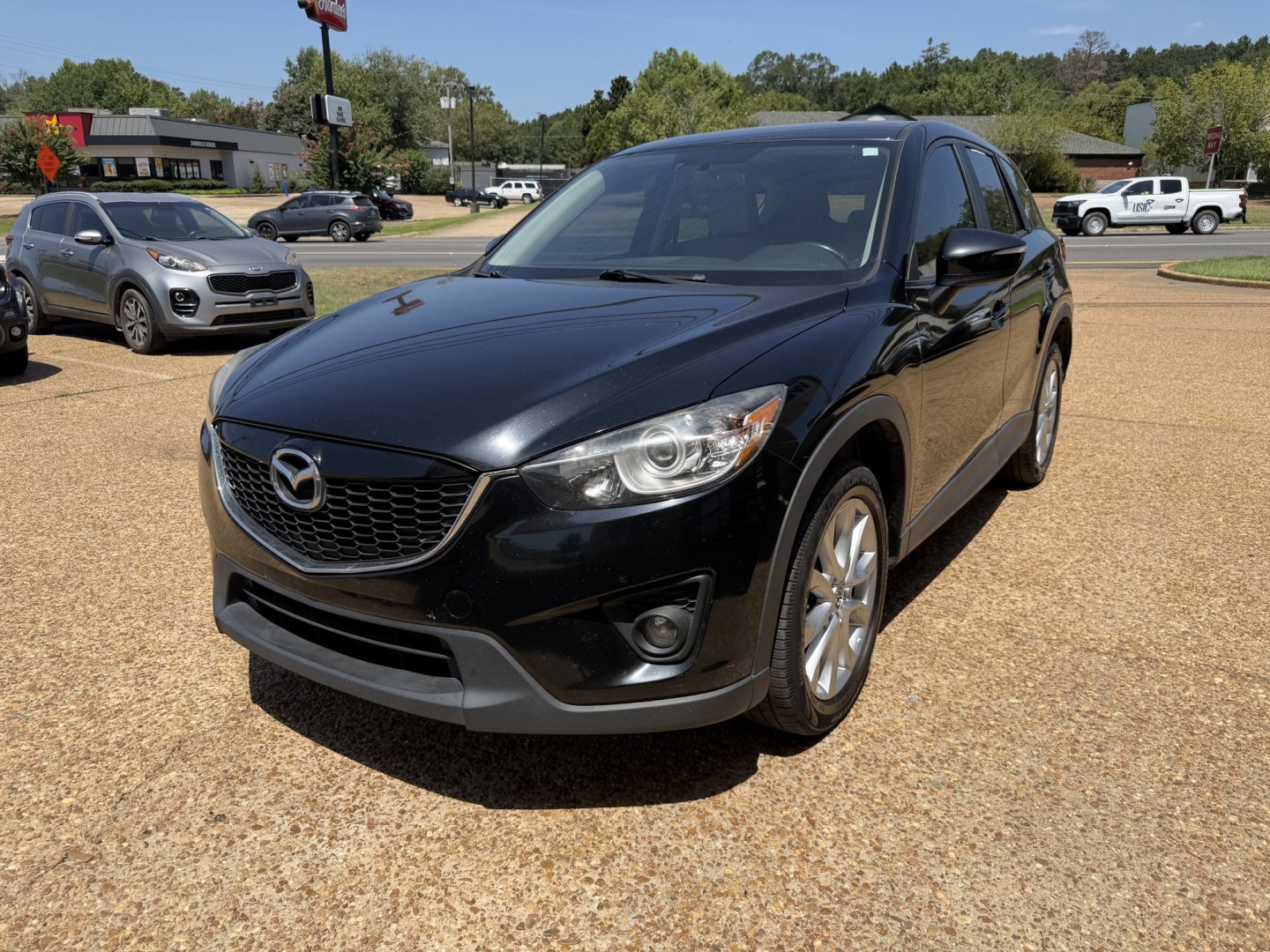 2015 BLACK MAZDA CX-5 GRAND TOURING (JM3KE2DY7F0) , located at 922 W. Beacon St., Philadelphia, MS, 39350, (601) 650-3675, 32.770447, -89.127151- Photo#2