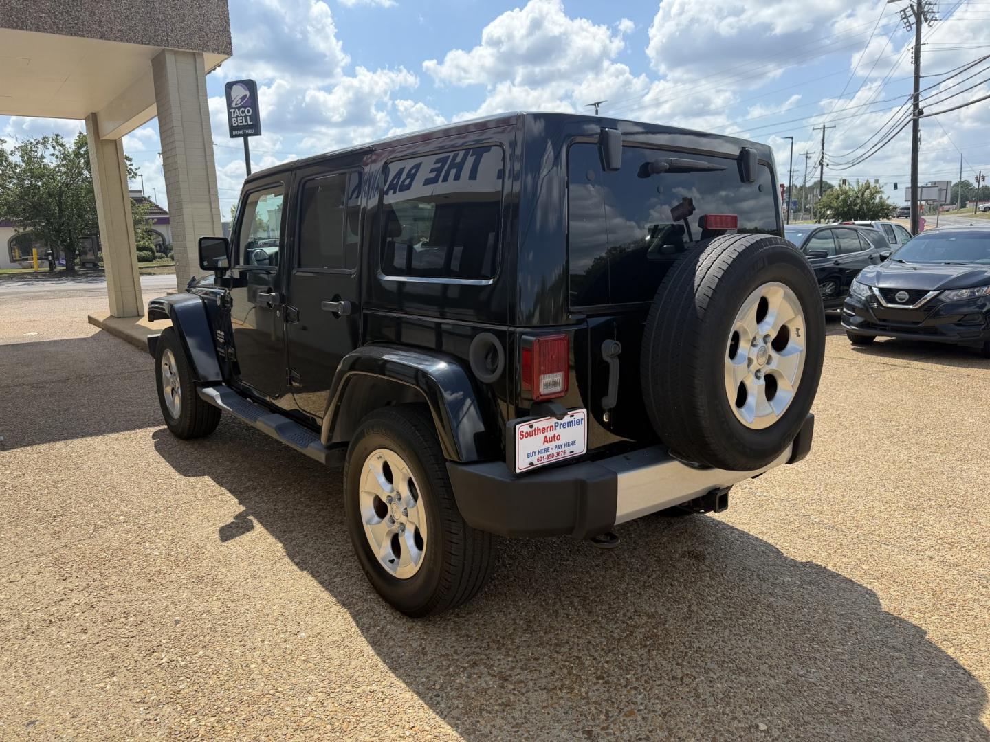 2013 BLACK JEEP WRANGLER UNLIMITED S (1C4HJWEG4DL) , located at 922 W. Beacon St., Philadelphia, MS, 39350, (601) 650-3675, 32.770447, -89.127151- Photo#3