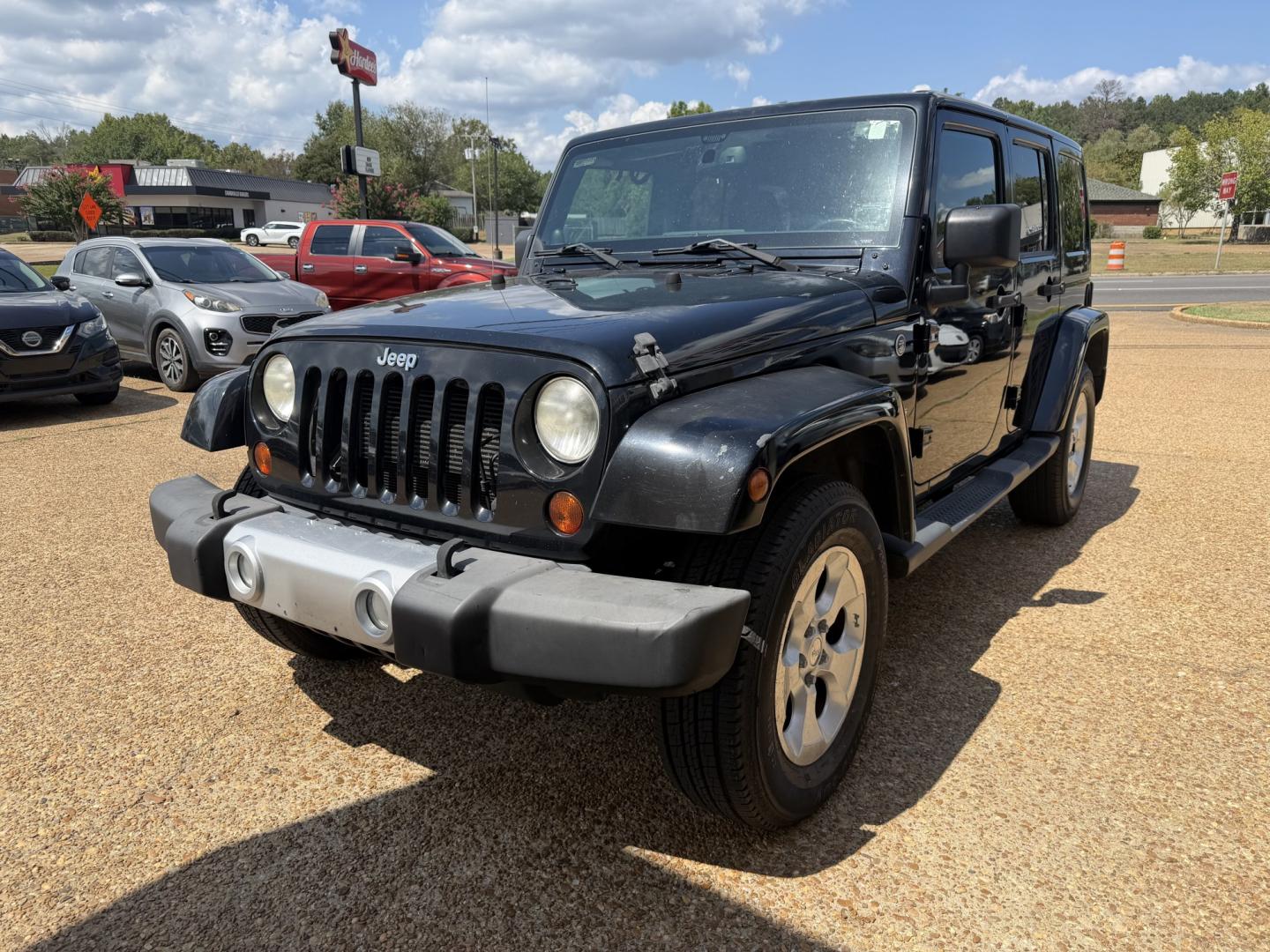 2013 BLACK JEEP WRANGLER UNLIMITED S (1C4HJWEG4DL) , located at 922 W. Beacon St., Philadelphia, MS, 39350, (601) 650-3675, 32.770447, -89.127151- Photo#2