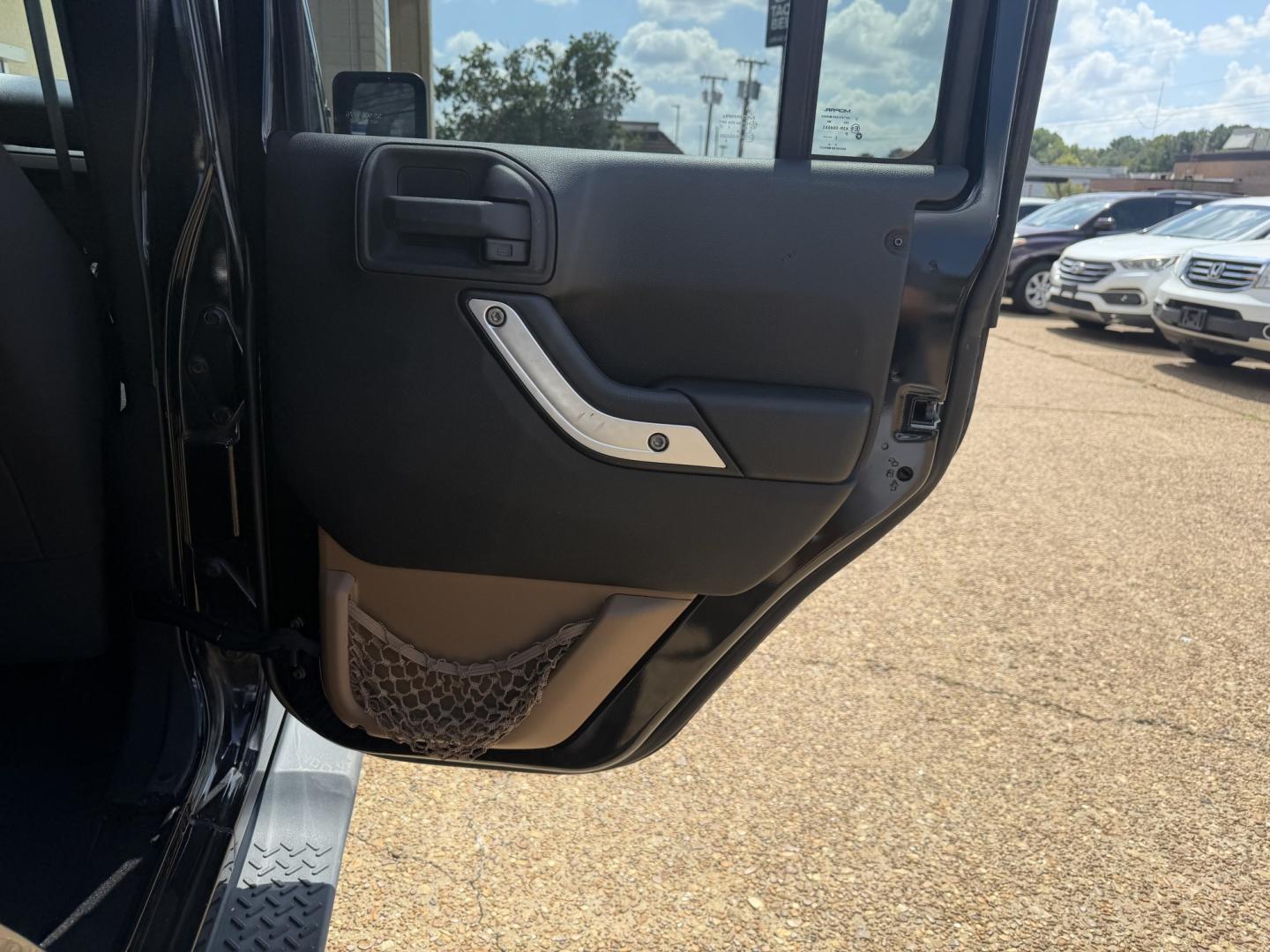2013 BLACK JEEP WRANGLER UNLIMITED S (1C4HJWEG4DL) , located at 922 W. Beacon St., Philadelphia, MS, 39350, (601) 650-3675, 32.770447, -89.127151- Photo#15