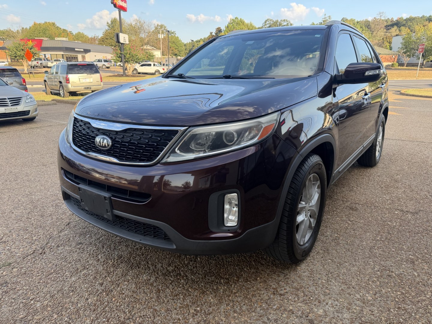 2015 BURGUNDY KIA SORENTO LX (5XYKT4A62FG) , located at 922 W. Beacon St., Philadelphia, MS, 39350, (601) 650-3675, 32.770447, -89.127151- Photo#2