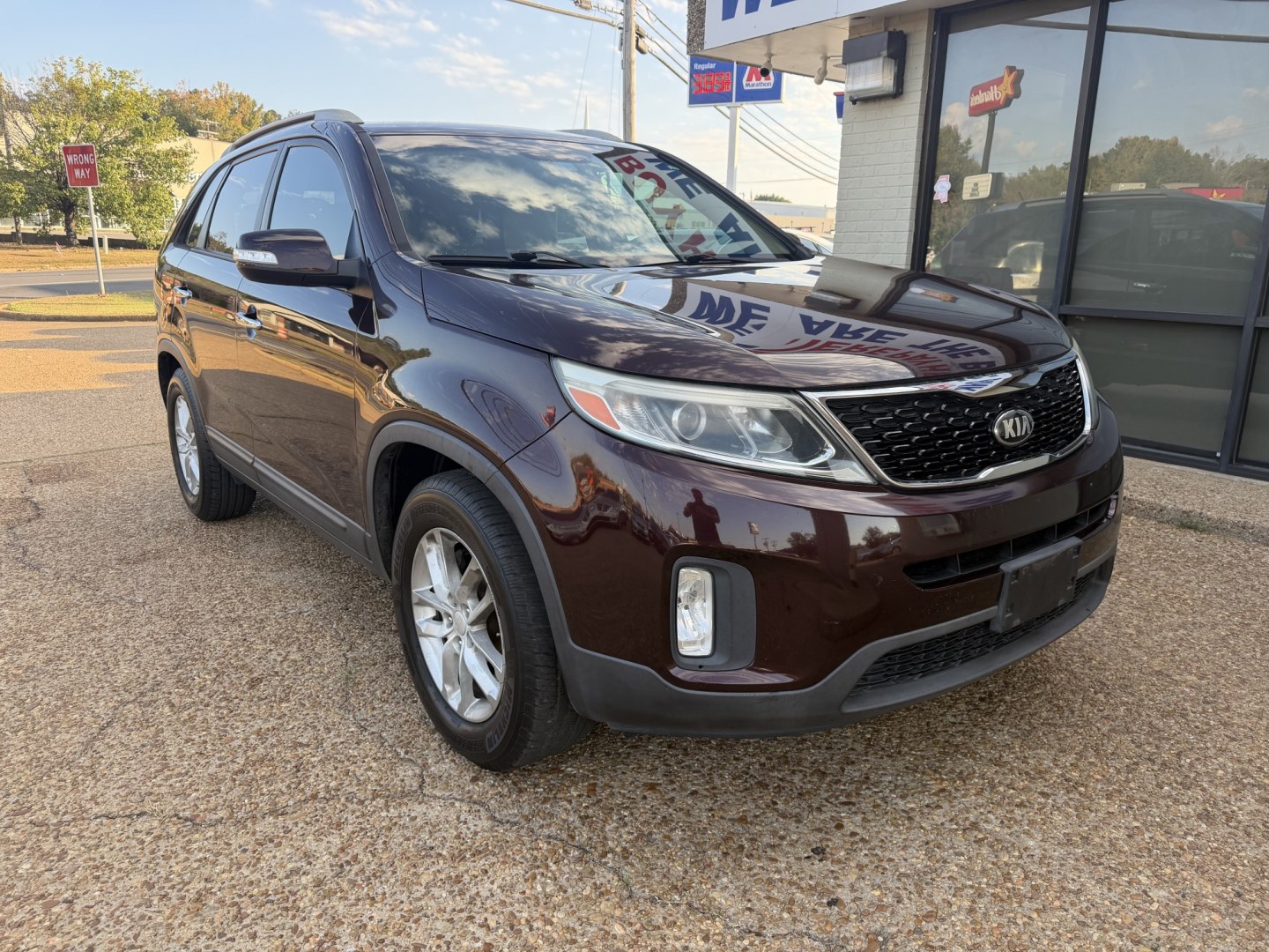 2015 BURGUNDY KIA SORENTO LX (5XYKT4A62FG) , located at 922 W. Beacon St., Philadelphia, MS, 39350, (601) 650-3675, 32.770447, -89.127151- Photo#0